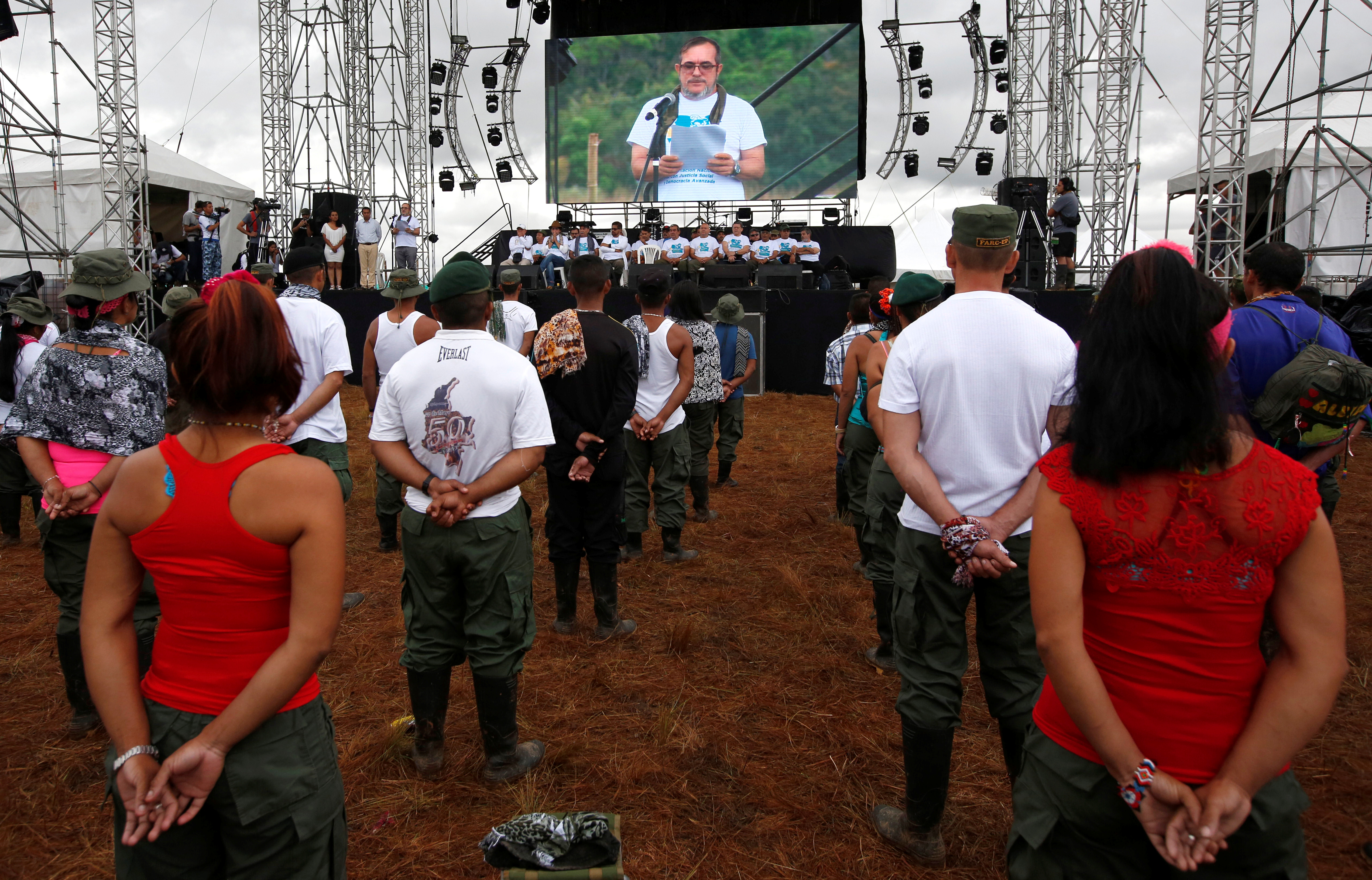 FARC rebel leader Rodrigo Londono, better known as Timochenko, is seen on a screen during the opening ceremony of the group’s congress at the camp where they prepare for ratifying a peace deal with the government, in Yari Plains, Colombia, on September 17, 2016. Source: John Vizcaino/Reuters.