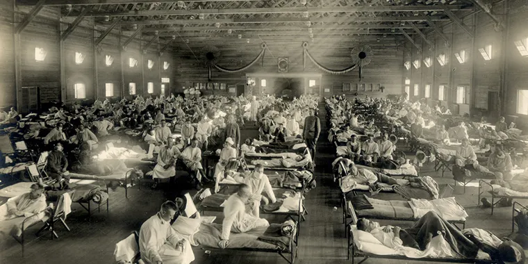 Patients are treated in an emergency hospital in Camp Funston, Kansas, in the midst of the influenza epidemic in 1918.