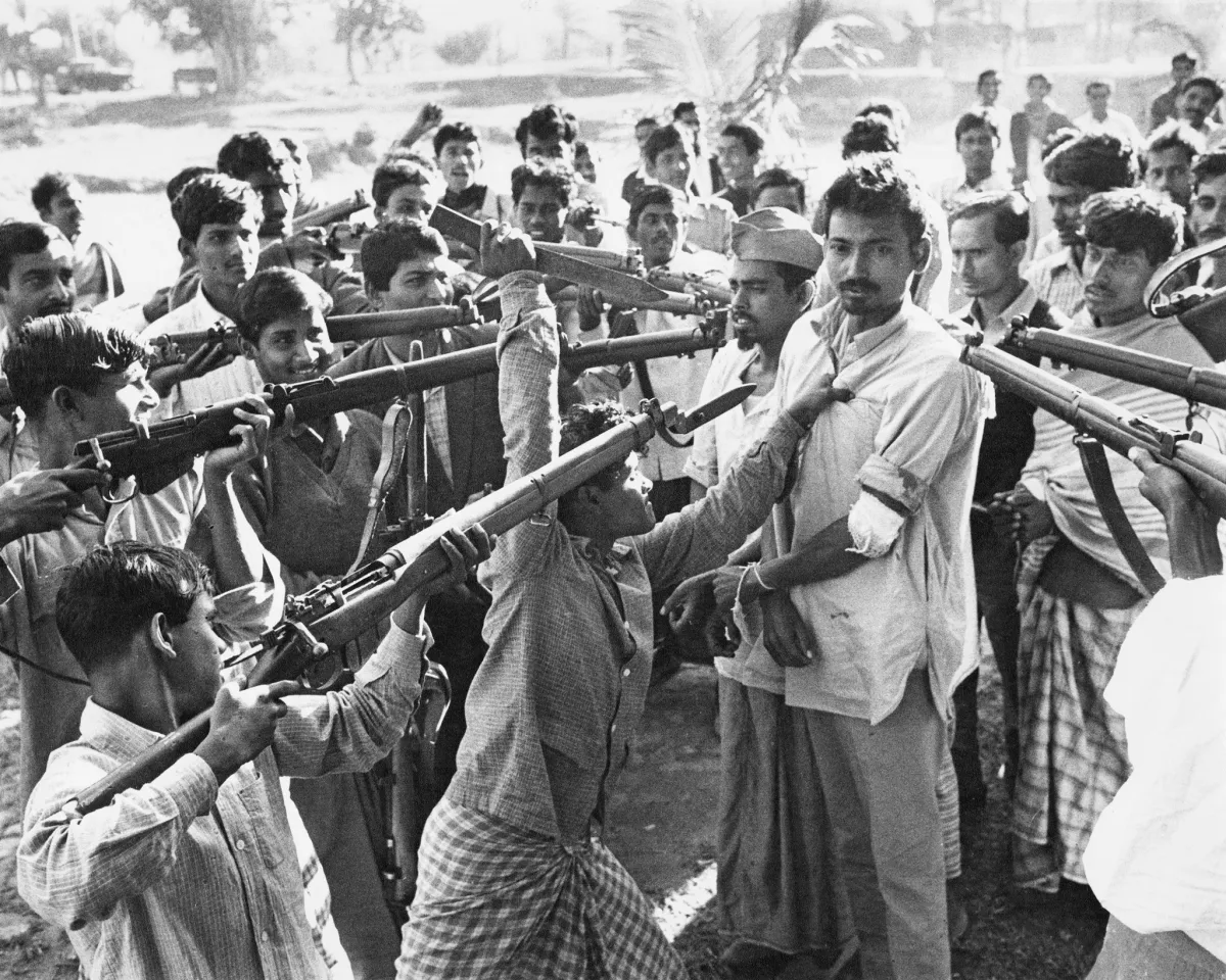 A photo showing Bangladeshi Freedom Fighters surrounding men accused of working with the government in East Pakistan, now Bangladesh, in 1971.