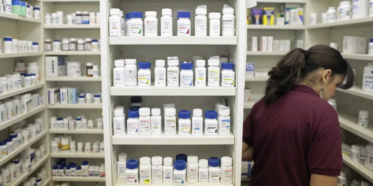A pharmacy employee looks for medication in New York, on December 23, 2009.