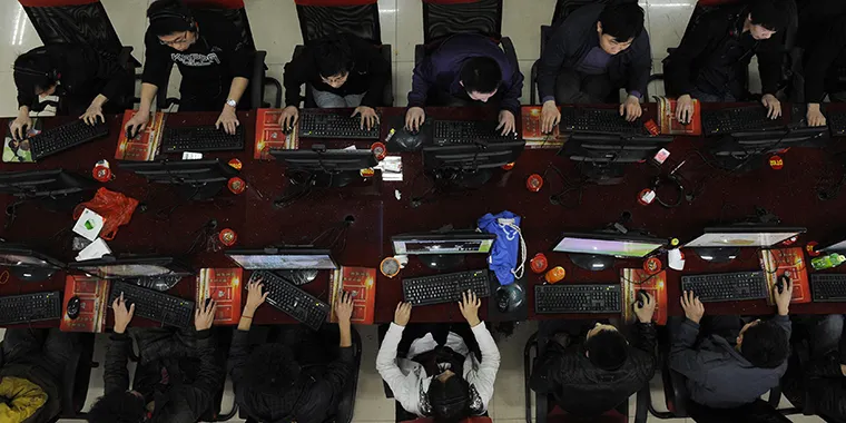 People use the computer at an Internet cafe in Taiyuan in the Shanxi province of China on March 31, 2010.