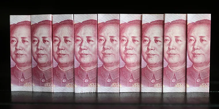 Chinese 100 yuan banknotes in Beijing on July 11, 2013. Investments from China usually come from state-owned companies and companies with close ties to the Chinese Communist Party.