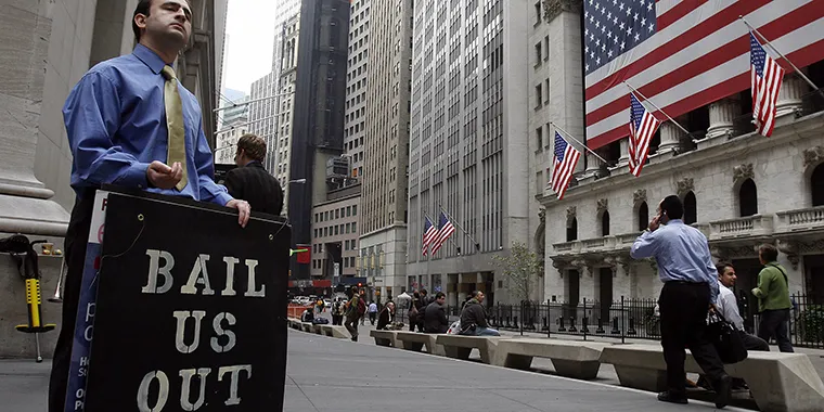 A man protests outside the New York Stock Exchange on October 13, 2008.
