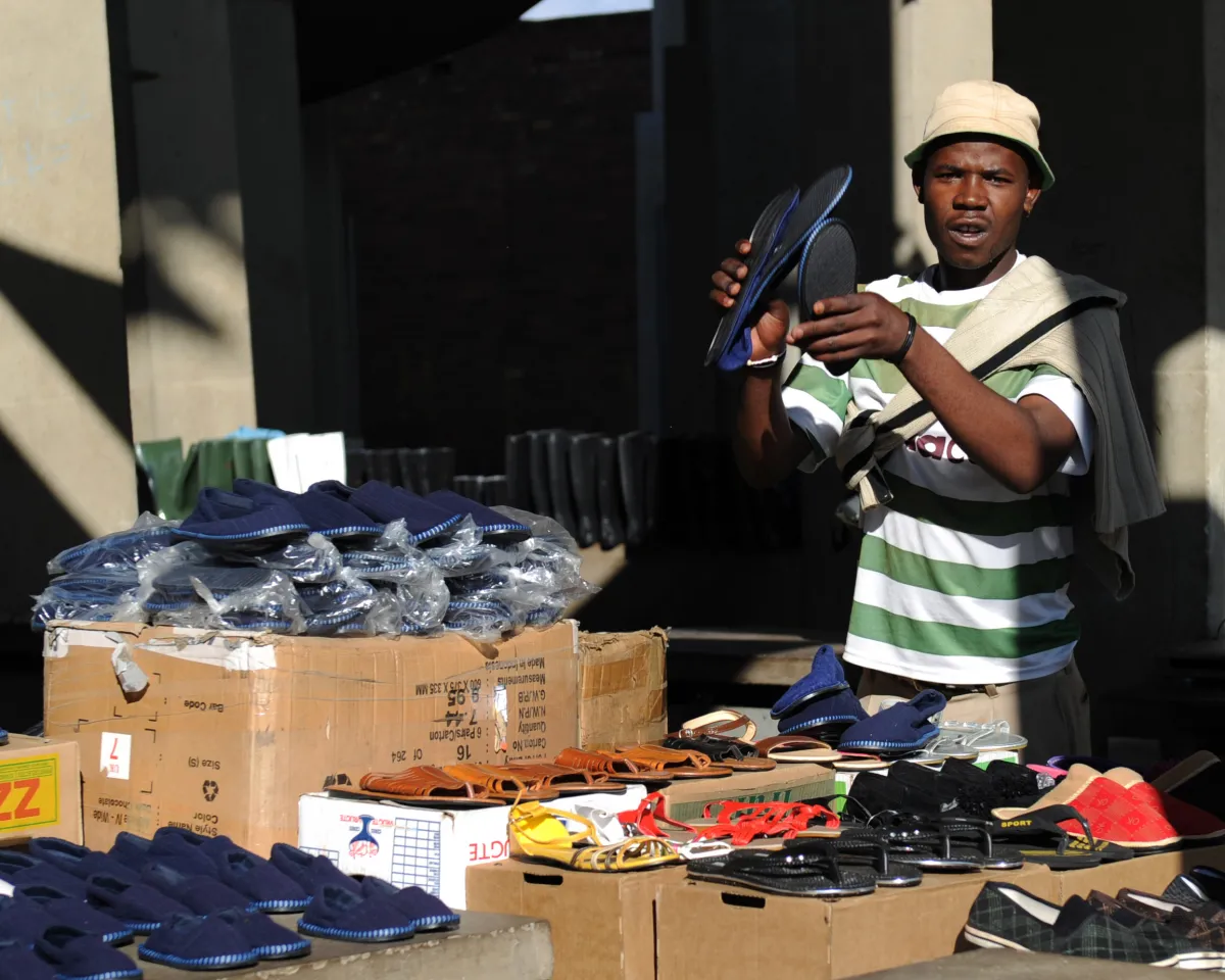 A photo showing a street vendor selling shoes in Soweto, South Africa on May 9, 2010.