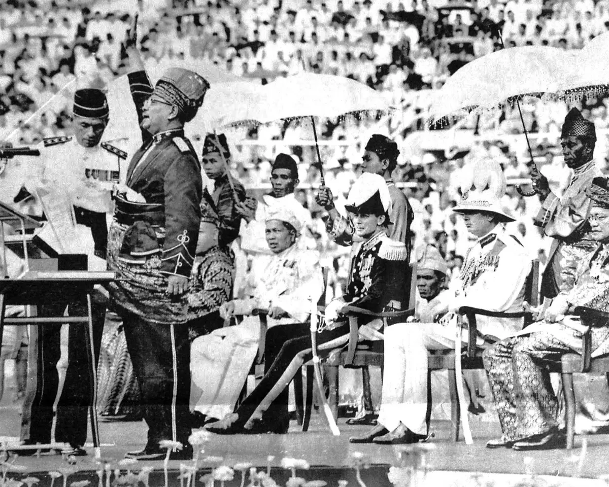 A photo of Malaysia's First Prime Minister, Tunku Abdul Rahman, reading the Proclamation of Independence in Kuala Lumpur, Malaysia on August 31, 1957.