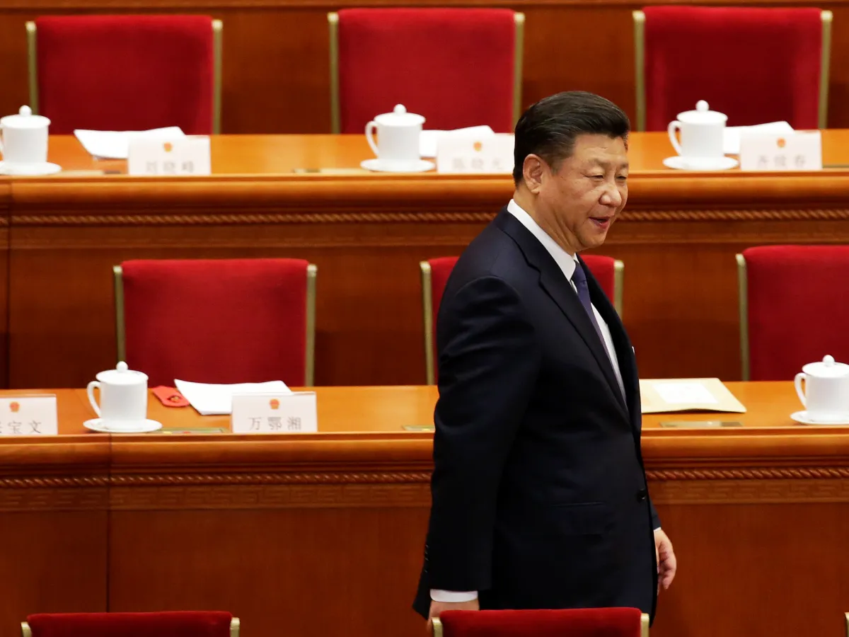 A photo showing Chinese President Xi Jinping arriving at a National People's Congress session in Beijing where delegates voted on a constitutional amendment lifting presidential term limits on March 11, 2018.