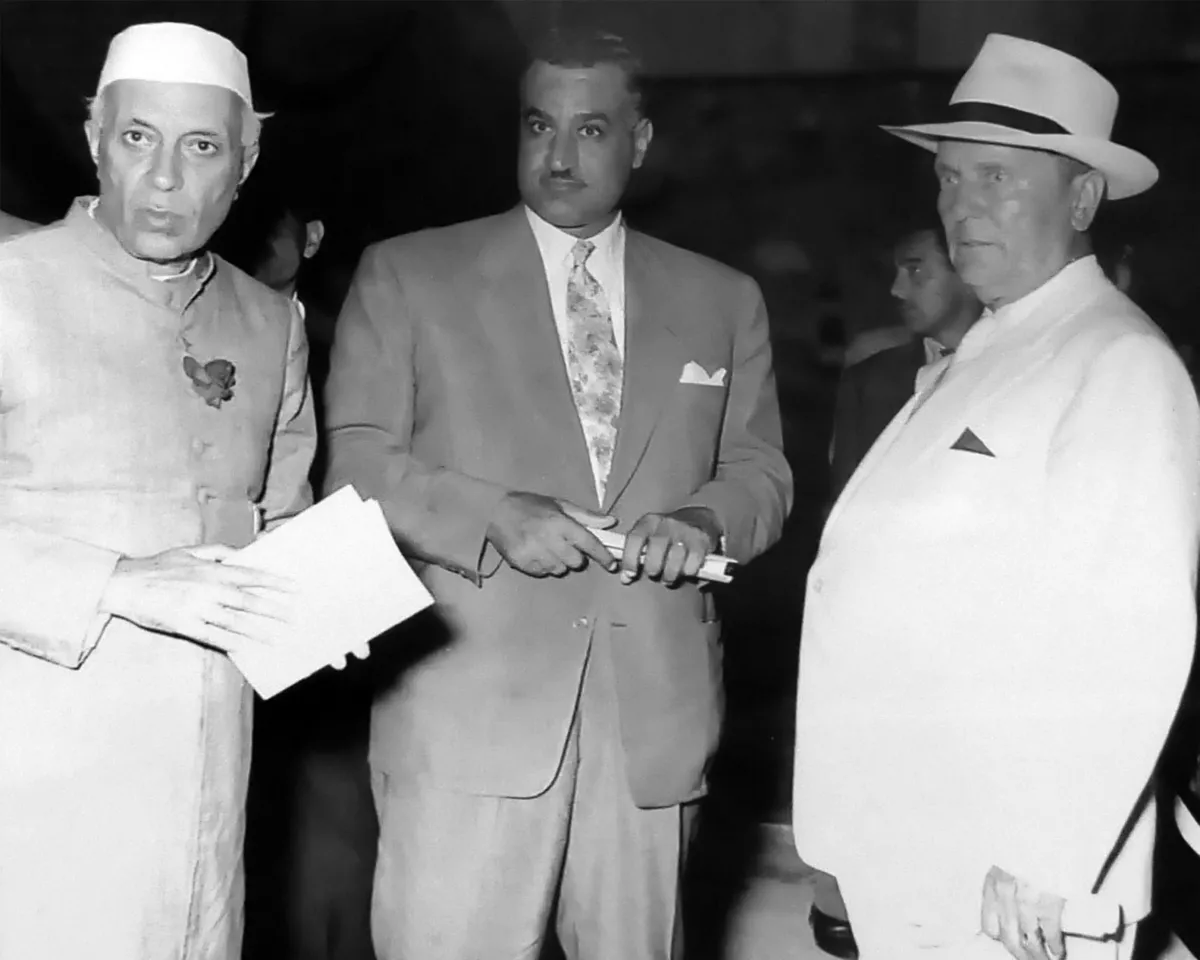 A photo showing Indian Prime Minister Jawaharlal Nehru, Egyptian President Gamal Abdel Nasser, and Yugoslav President Josip Broz Tito meeting to sign the establishment of the Non-Aligned Movement on July 19, 1956.