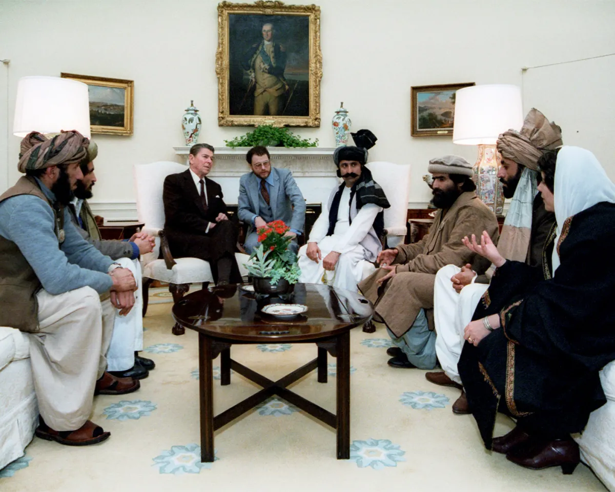 A photo of U.S. President Ronald Reagan meeting with Afghan Mujahideen to discuss the Soviet invasion of Afghanistan, in February 1983.