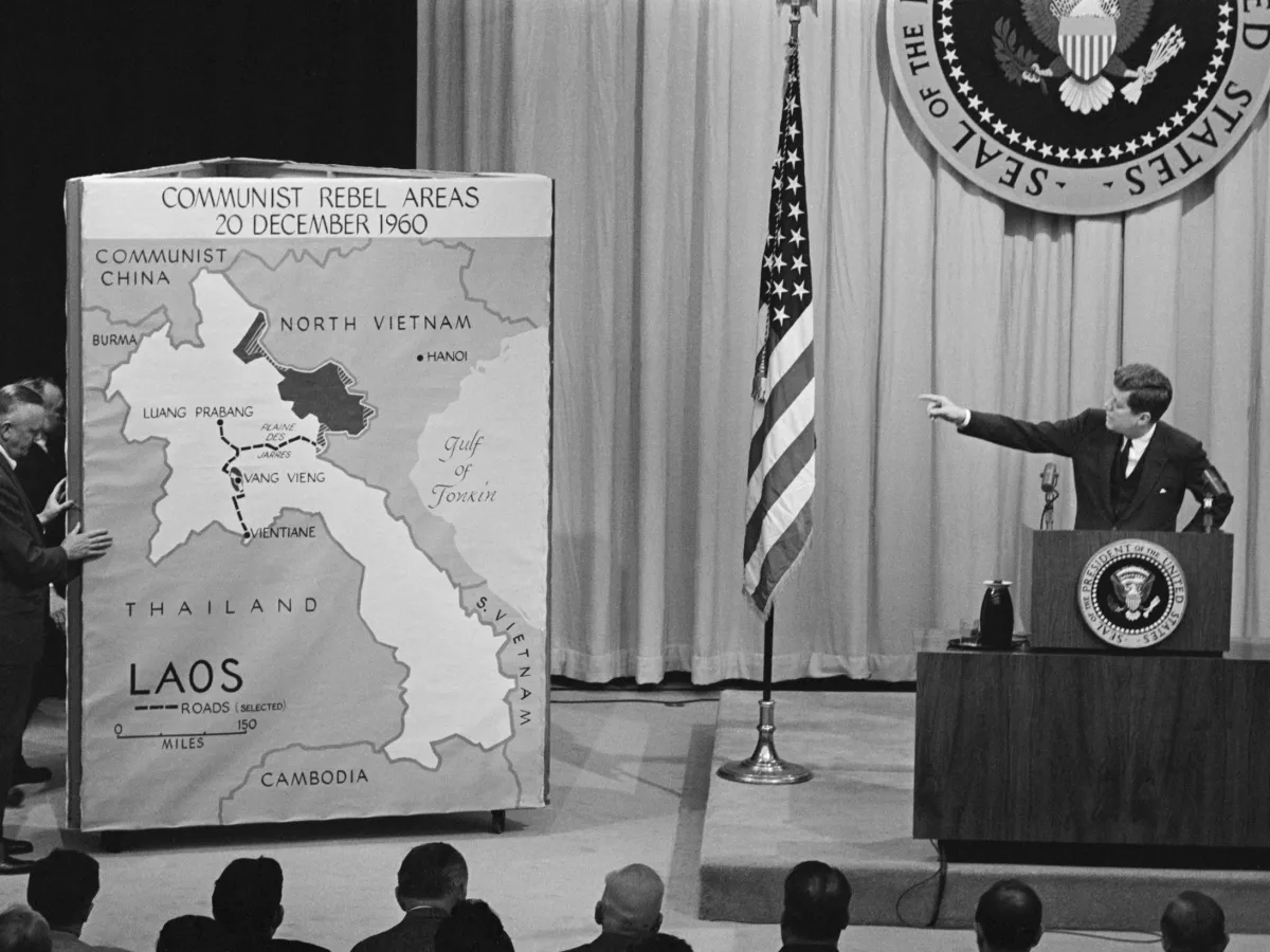 A photo showing President John F. Kennedy pointing to a map of Laos while discussing the growth of Communism in southeast Asian countries at a news conference on March 23, 1961.