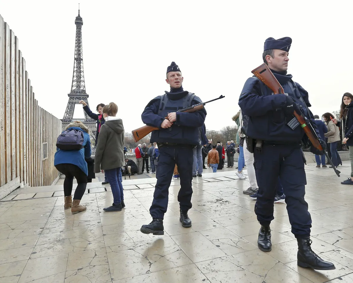 A photo showing police patrolling near the Eiffel Tower on Novemeber 14, 2015, the day after a series of deadly attacks in Paris.