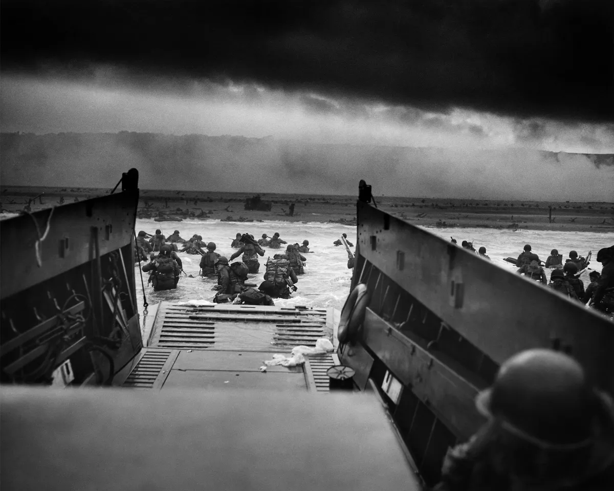 A photo showing U.S. troops wading through water after reaching Normandy, France and landing Omaha beach on D Day, June 6, 1944.