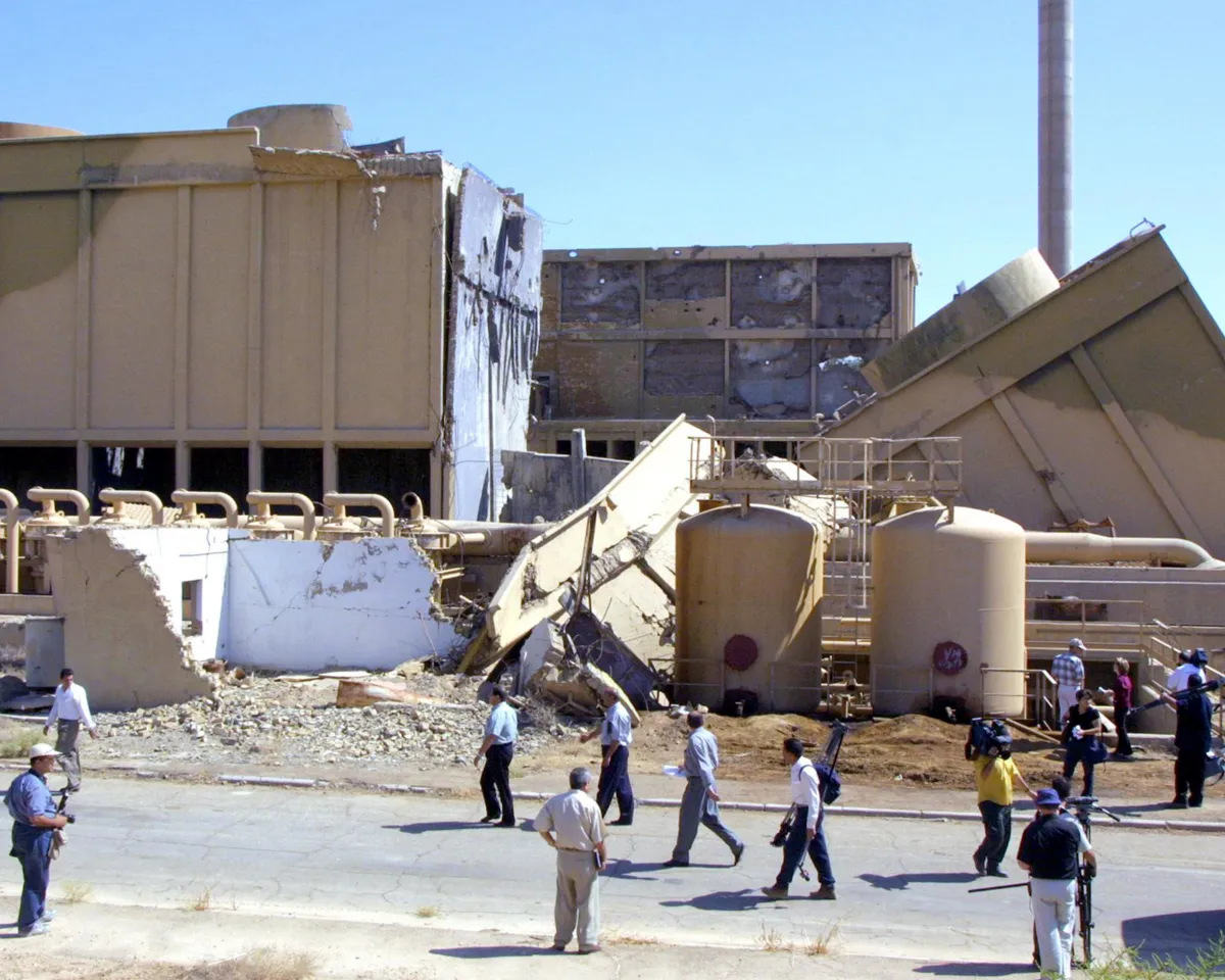 A photo of journalists being shown the destroyed Tammuz Iraqi nuclear reactor bombed by Israel during an air raid in 1981 and hit again during the 1991 Gulf War, outside of Baghdad, Iraq, on September 9, 2002.