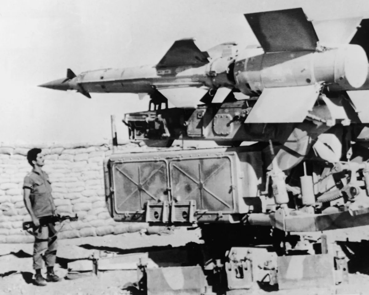 A photo of an Israeli soldier looking at a Soviet-built Egyptian missile launcher captured by Israeli forces on the bank of the Suez Canal on October 21, 1973.