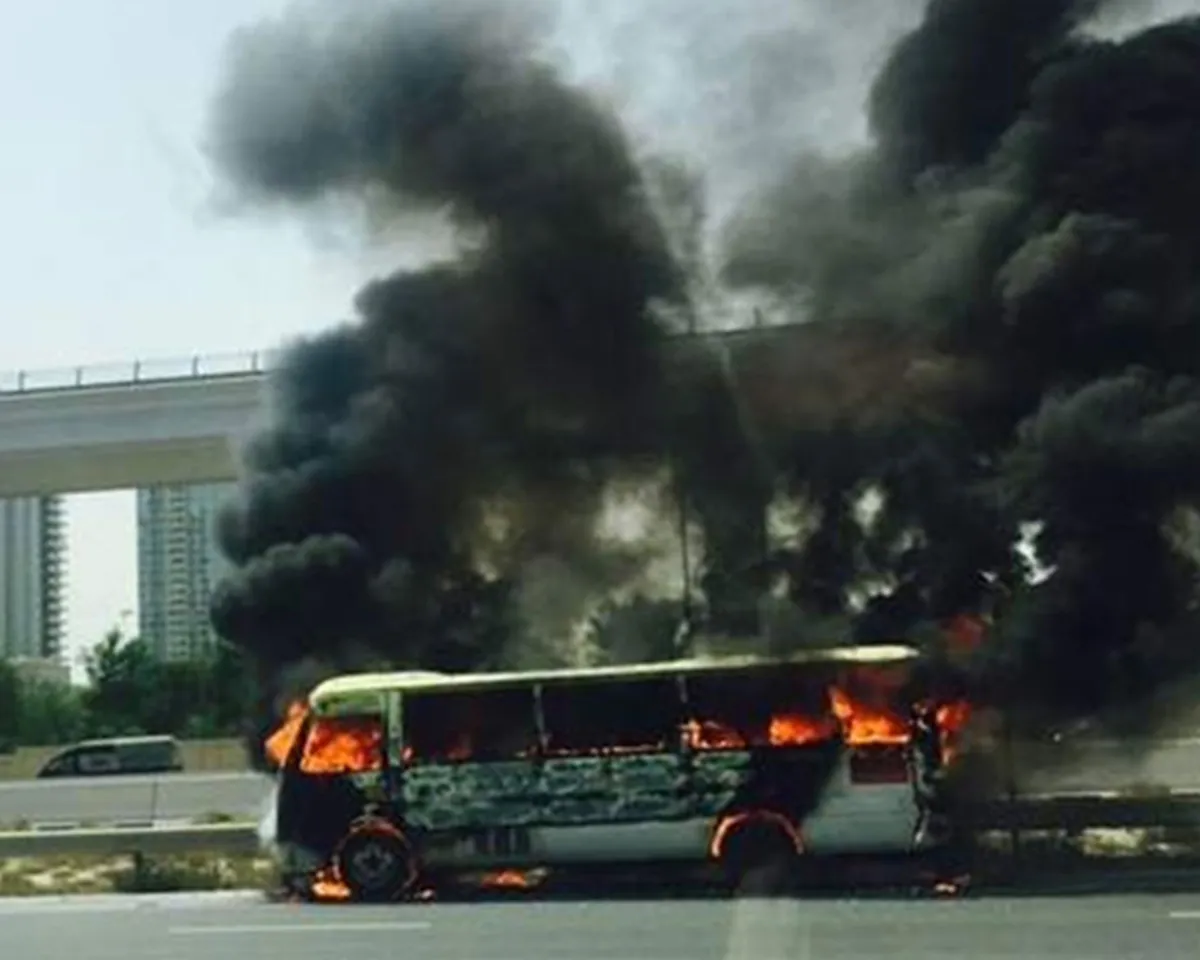 A photo showing a mini bus bursting into flames while traveling from Abu Dhabi to Dubai Media City in the United Arab Emirates on August 2, 2017.