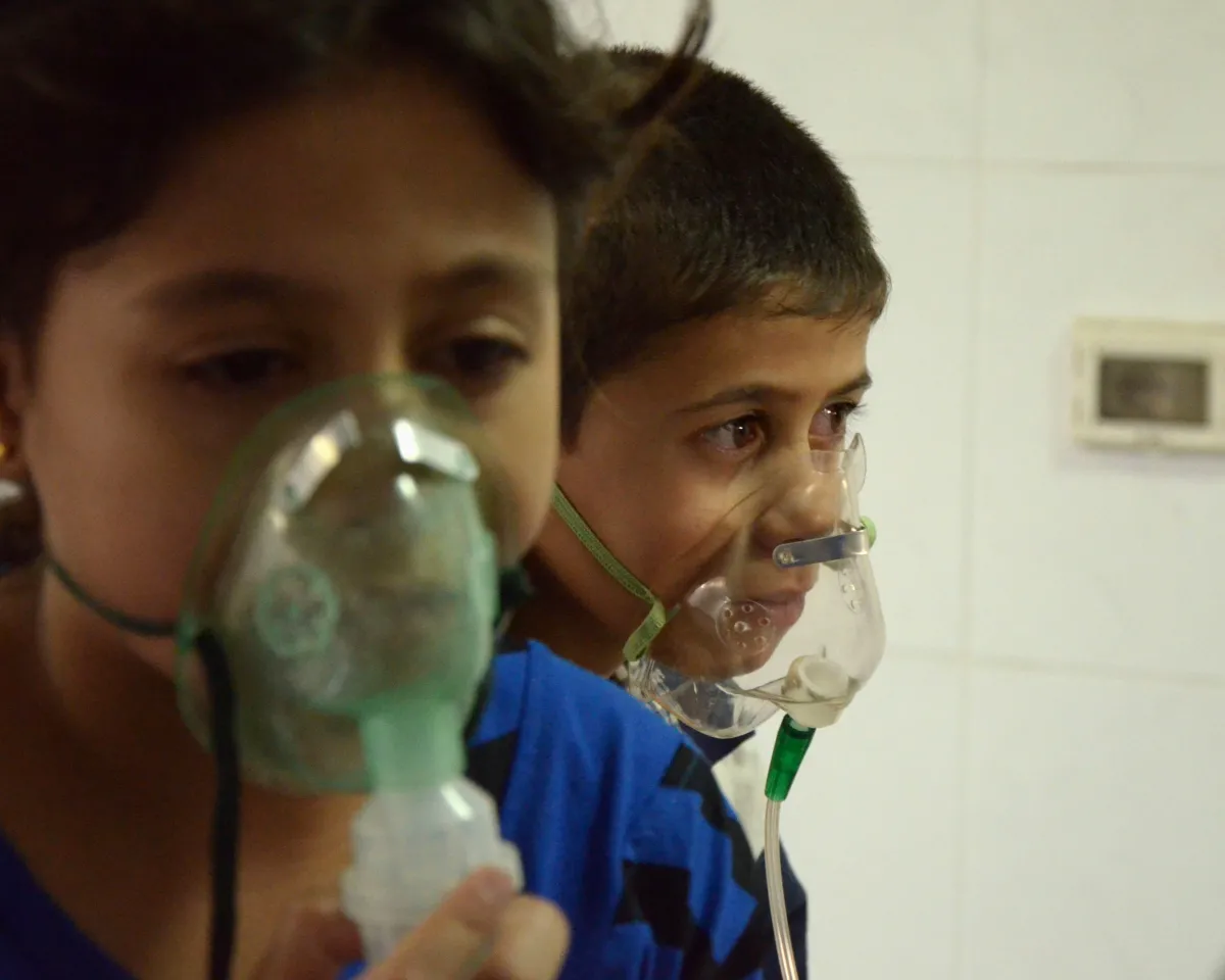 A photo showing children, affected by an apparent gas attack, breathing through oxygen masks in Damascus, Syria, on August 21, 2013.