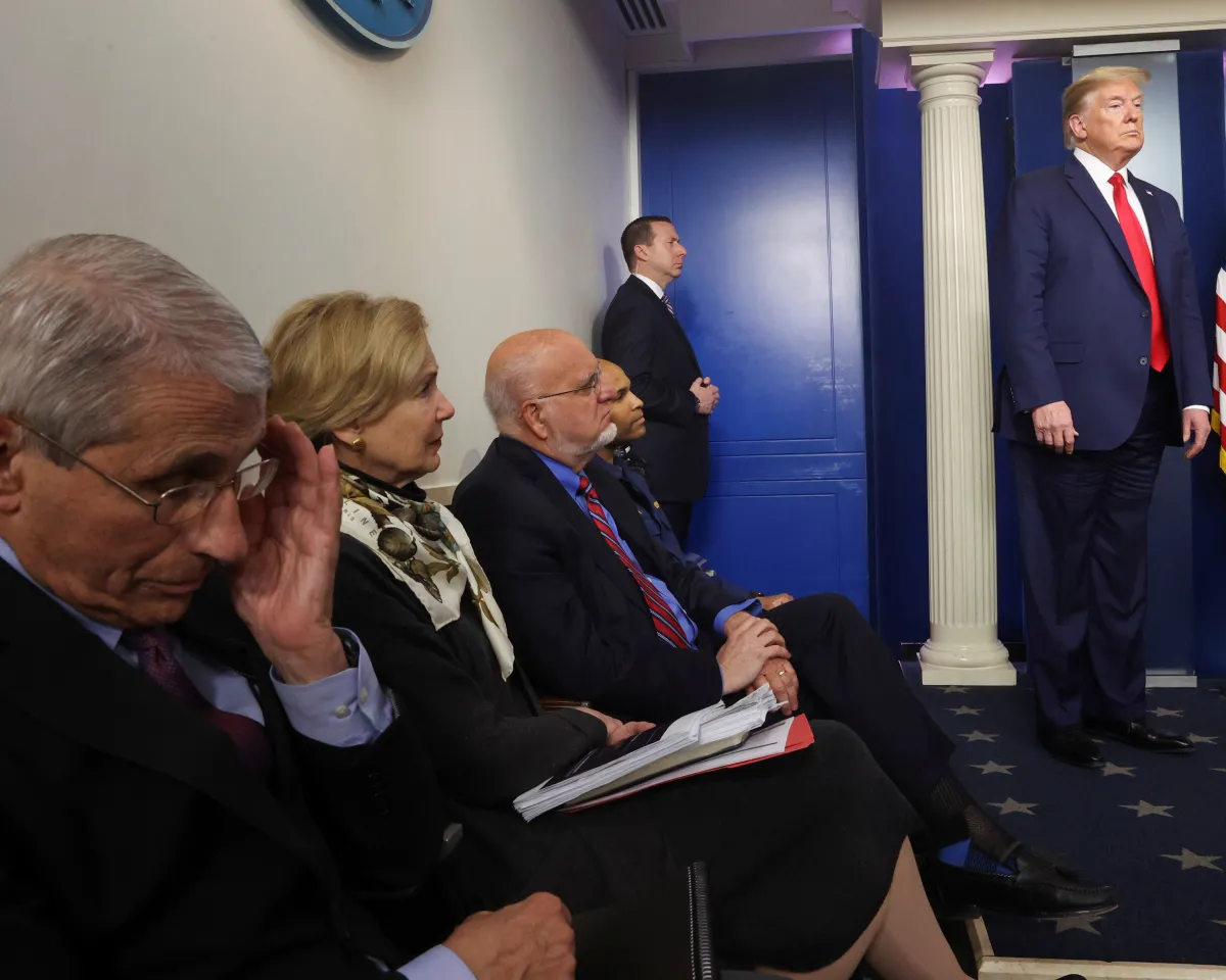 A photo showing White House medical advisors listening to the daily coronavirus task force briefing with President Donald Trump at the White House in Washington, DC, on April 22, 2020.
