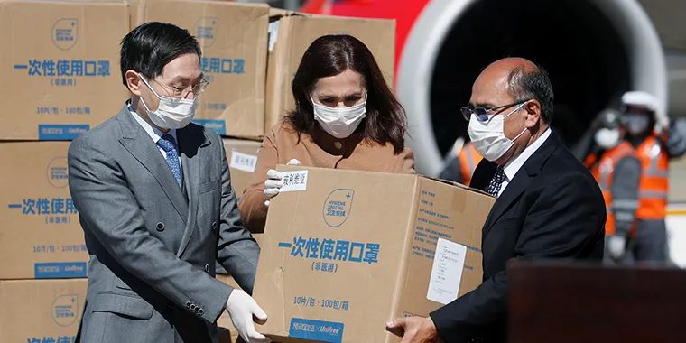 China's Ambassador Huang Yazhong, Bolivia's Foreign Minister Karen Longaric, and Health Minister Anibal Cruz attend the donation ceremony of medical supplies from China's Alibaba Foundation, amid the spread of coronavirus disease (COVID-19).