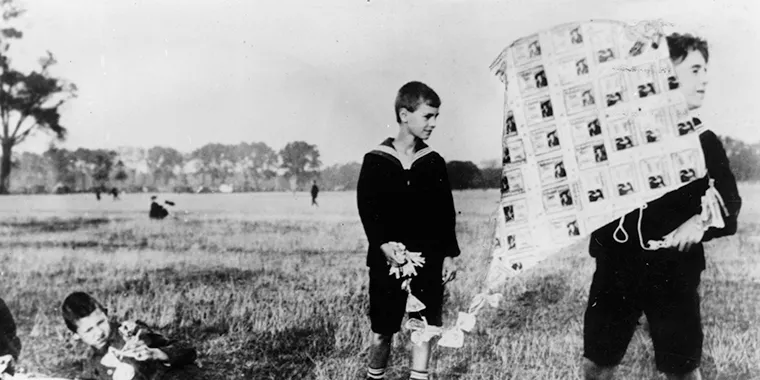 A boy holds a kite made of banknotes in Germany in 1922, during an economic crisis in which Germany currency lost much of its value.