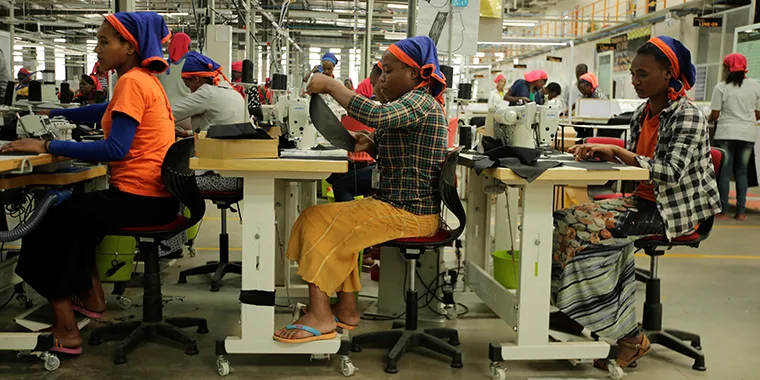 Workers sew clothes inside the Indochine Apparel PLC textile factory in Hawassa Industrial Park in the Southern Nations, Nationalities and Peoples region of Ethiopia on November 17, 2017.
