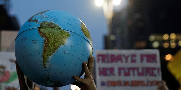 A person holds a globe during the Global Climate Strike of the Fridays for Future movement in Sao Paulo, Brazil, on September 20, 2019.