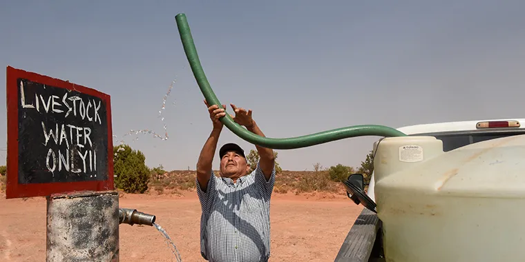A rancher fills up his water tank at the livestock water spigot at the Bodaway chapter of the Navajo Nation in Gap, Arizona, on September 17, 2020.