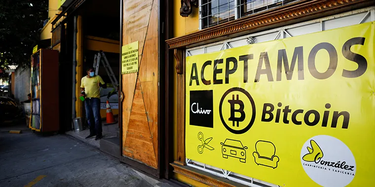 A banner that reads "We accept Chivo and Bitcoin" is seen outside a business in Antiguo Cuscatlan, El Salvador, on September 17, 2021.