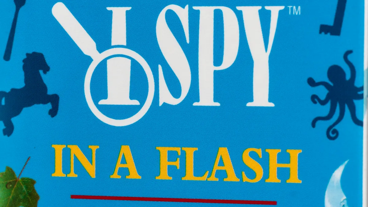 An "I Spy in a Flash" card game box from the "Scholastic" brand owned by Scholastic Inc.