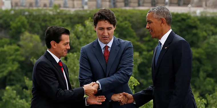 Mexico's President Enrique Peña Nieto, Canada's Prime Minister Justin Trudeau and U.S. President Barack Obama shake hands while posing for a photo at the North American Leaders' Summit in Ottawa, Ontario, Canada, on June 29, 2016.