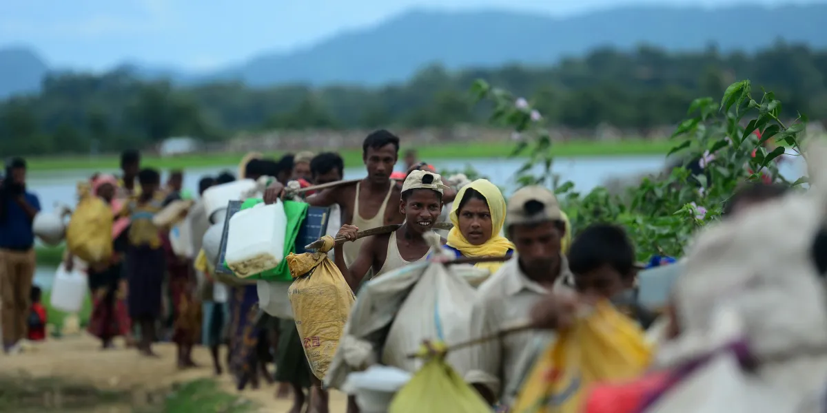 Rohingya walk near the no man's land area between Bangladesh and Myanmar in the Palongkhali area next to Ukhia on October 19, 2017.