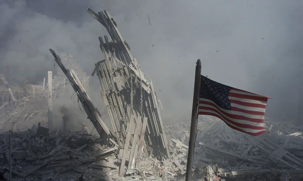 American flag flies amid the rubble and debris from the collapsed World Trade Center towers