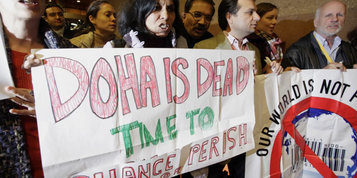 Activists of various nongovernmental organizations demonstrate against the Doha Round of global trade talks before the closing ceremony of the seventh WTO ministerial meeting in Geneva, on December 2, 2009.