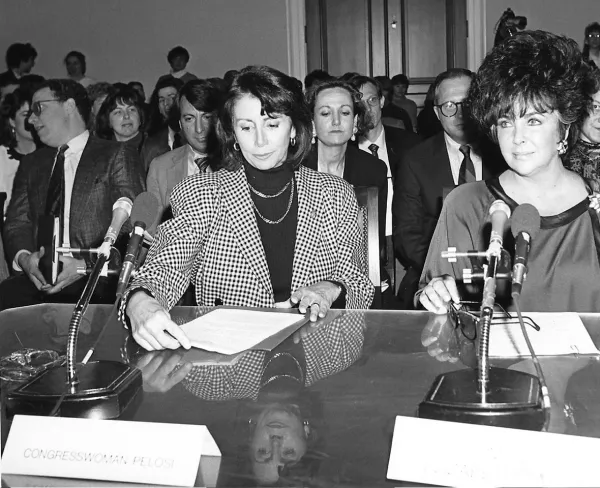 Congresswoman Nancy Pelosi and actress Elizabeth Taylor—both early, high-profile voices in the call for AIDS intervention—testify on HIV/AIDS funding before the House Budget Committee on March 6, 1990.