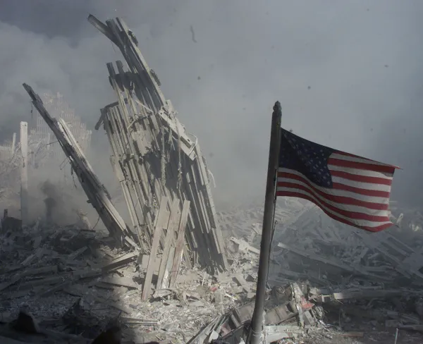 A U.S. flag flies near the base of the destroyed World Trade Center in New York, on September 11, 2001.