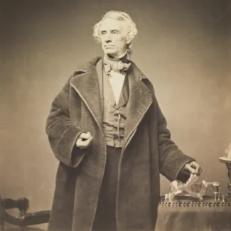 Samuel Morse with a telegraph receiver in 1857.