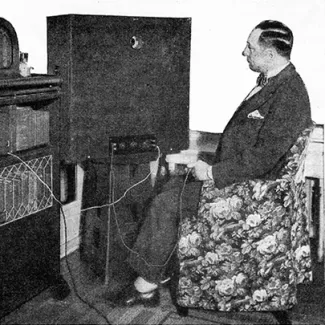 Hugo Gernsback, the editor of Radio News, watches television in his New York apartment, in August 1928.