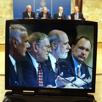British researcher Tim Berners-Lee (far right) and American researchers Robert Kahn (far left), Lawrence Roberts (second from left), and Vinton Cerfy (second from right) are shown in a laptop's screen during a joint news conference in Oviedo, Spain, on October 24, 2002.