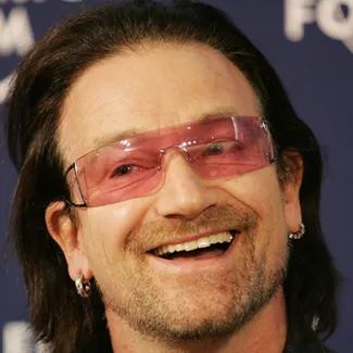 Irish singer Bono smiles during the launch of an initiative to help fund the Global Fund to Fight AIDS, Tuberculosis and Malaria at the World Economic Forum in Davos, Switzerland, on January 26, 2006.