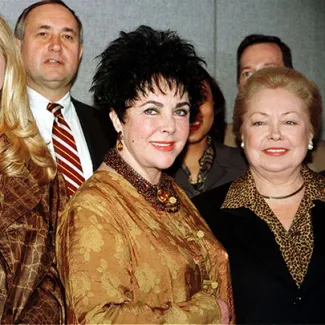 From left, actress Elizabeth Taylor and Mathilde Krim, chair of the American Foundation for AIDS Research, pose at the United Nations in New York on December 2, 1996, before a World AIDS Day luncheon.