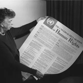 Eleanor Roosevelt holds a poster of the Universal Declaration of Human Rights in Lake Success, New York, in November 1949.