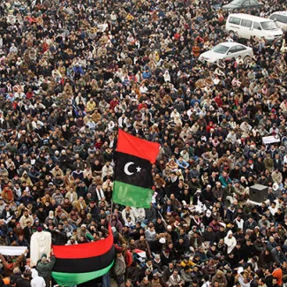 Anti-Gaddafi protesters attend Friday prayers in Benghazi on February 25, 2011.