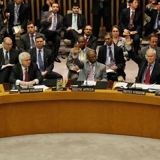 Members of the UN Security Council vote in favor of the resolution to impose a no-fly zone on Libya at the UN headquaters in New York on March 17, 2011. The Russian representative (left) abstained from the vote.