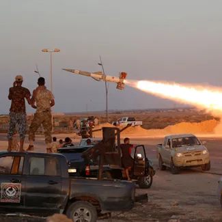 Libyan forces allied with the UN-backed government fire a rocket at Islamic State forces in Sirte, Libya, as fighting continues years after the NATO intervention, on August 4, 2016.