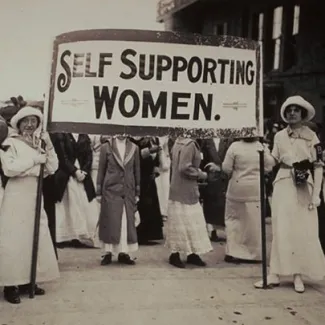 Young women hold a sign that reads “Self Supporting Women” at a rally in Boston, Massachusetts, in May 2, 1914.
