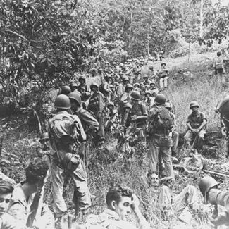 Marines rest in the field on Guadalcanal some time between August and December 1942.