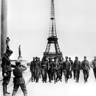 Nazi soldiers visit the Eiffel Tower in Paris in  July 1940. 