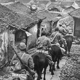 Japanese troops enter Manchuria on horseback during their 1931 invasion of the Chinese province.