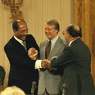 Anwar Sadat, Jimmy Carter, and Menachem Begin at the Camp David Accords signing ceremony on September 17, 1978.