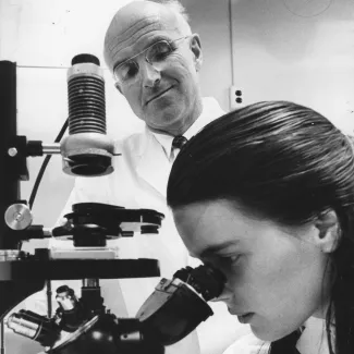 Dr. Joseph E. Murray looks on as a lab tech searches for good matches for kidney transplants at Peter Bent Brigham Hospital in Boston on February 19, 1970. 