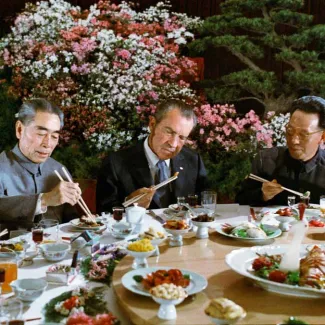 U.S. President Richard Nixon uses chopsticks during a Chinese state banquet given in his honor with Chinese Premier Zhou Enlai in Hangzhou, China, on February 2, 1972.