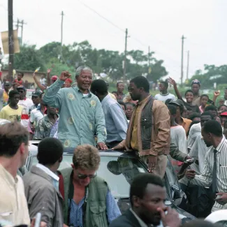Nelson Mandela acknowledges a crowd of ANC supporters on April 21, 1994 at a pre-election rally in Durban days before the historic democratic election on April 27, 1994 in South Africa.